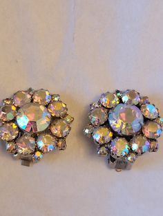 Beautiful Crystal Aurora Borealis Earrings Excellent Condition Please see photos for details. Vintage Sparkling Earrings For Gift, Clip-on Costume Jewelry Earrings For Wedding, Round Costume Jewelry Earrings For Party, Iridescent Jewelry With Matching Earrings For Wedding, Iridescent Wedding Jewelry With Matching Earrings, Round Clip-on Bridal Earrings For Party, Party Bridal Round Clip-on Earrings, Wedding Jewelry Earrings, Earrings Vintage