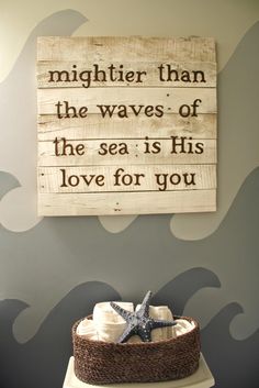 a wooden sign that reads, mightier than the waves of the sea is his love for you