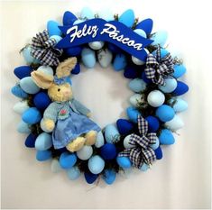 a blue and white wreath with a bunny on it