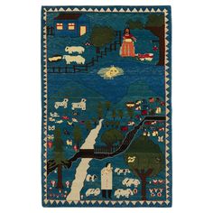 a blue rug with animals and trees on it