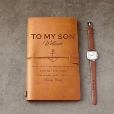 a personalized leather notebook with a watch on the side and an engraved message to my son