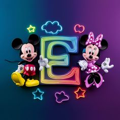 mickey and minnie mouse standing next to each other in front of the letter e with neon lights