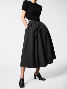 Classic mid-calf length flared and pleated skirt. Voluminous style. Oversized A line skirt. Model is in MINUSEY S. ✔️ Free worldwide express shipping over $100✔️ Loved by 6,500+ customers✔️ Limited edition collections, maximum style⠀⠀⠀⠀⠀⠀⠀⠀⠀Stay ahead of the trend with can’t-find-anywhere-else staples. Your closet will thank you 💕 * MINUSEY S = EU 34, US 2* MINUSEY M = EU 36, US 4* 100% Polyester* Dry clean* Made in Korea - Model Height: 172cm/5'7" (US2, EU34) Black A-line Voluminous Skirt, Evening Voluminous Midi Skirt, Black Midi Length Gathered Skirt, Gathered Midi Skirt For Evening, Black A-line Pleated Maxi Skirt, Pleated Hem Midi Bottoms For Evening, Evening Midi Bottoms With Pleated Hem, Black Pleated Wide Leg Culottes, Black Flared Skirt With Pleated Hem