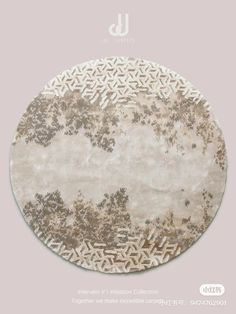 a round rug with an intricate design on the top and bottom, in beige tones