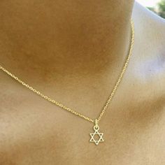 Add some faith and style to your everyday look with our Tiny Jewish Star of David Necklace! This delicate necklace features a tiny Star of David pendant, perfect for showing off your Jewish heritage in a subtle and fashionable way. You'll love adding this unique and meaningful piece to your jewelry collection! * Sterling silver * 1/4" * 16" rolo chain with a 2" adjustable extender Star Of David Jewelry, Character Scenarios, Jewish Fashion, Jewish Necklace, Star Of David Necklace, Hand Chain Bracelet, Jewish Heritage, Starburst Necklace, Jewish Star