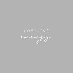 the words positive energy are written in white on a gray background with a black and white photo