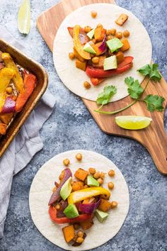 two tortillas topped with vegetables and chickpeas