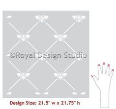 the royal design studio wall stencil is shown with two hands and one hand