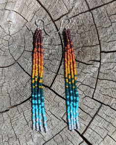 Embrace your inner bohemian goddess with our fan favorite long fringe beaded earrings. This unique rainbow color effect is inspired by a vibrant sunset over the ocean. Beautifully dramatic, comfortably lightweight. Enjoy the playful, free flowing style of beaded fringe earrings, without the weight. Hand-strung Dangle Earrings For Festivals, Bohemian Long Drop Beaded Earrings With Dangling Beads, Bohemian Beaded Long Drop Earrings, Multicolor Bohemian Beaded Earrings, Long Drop Beaded Tassel Earrings For Festival, Bohemian Long Drop Earrings With Colorful Beads, Long Drop Beaded Fringe Earrings For Festivals, Beaded Fringe Long Drop Earrings For Festivals, Bohemian Beaded Long Drop Tassel Earrings