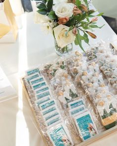 a table topped with lots of candy and flowers