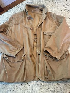 Vintage 1960s 70s Hunting Jacket Khaki Canvas  Distressed with holes and stains. Game pockets inside.   Multiple exterior pockets - quality details.   Quality Brand of American Field  Size Large or XL but see pics for measurements  Awesome naturally worn patina.   Quick shipping.   We ship same or next day with USPS shipping  We are a small family business and we appreciate your purchase, Godspeed ! Vintage Khaki Cotton Blazer, Vintage Khaki Outerwear With Patch Pockets, Vintage Khaki Blazer With Pockets, Vintage Khaki Sport Coat For Work, Vintage Khaki Single-breasted Sport Coat, Vintage Single-breasted Khaki Sport Coat, Vintage Cotton Utility Jacket With Flap Pockets, Vintage Khaki Sport Coat With Buttons, Vintage Cotton Utility Jacket With Pockets