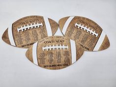 four football coasters with names on them