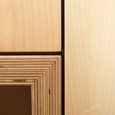 close up view of wood grains on the side of a cabinet door with an opening