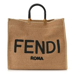 This is an authentic FENDI Straw Vitello King Plexiglass Woven Large Fendi Sunshine Shopper Tote in Natural and Black. This stylish shopping tote is crafted of tan raffia and features resin top handles, gold hardware, and woven raffia patches spelling out the Fendi logo. The top opens to a raffia interior. Fendi Sunshine, Resin Top, Fendi Logo, Woven Raffia, Shopper Tote, Shopping Tote, Gold Hardware, Straw, Fendi