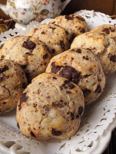 chocolate chip cookies are on a white plate