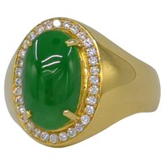 This exquisite ladies' ring is crafted in 18K white gold and weighs 6.50 grams. It features a stunning oval cabochon of intense green jadeite at its center. The jadeite is of A-grade quality, as certified by the NGTC (National Gemstone Testing Center), and exhibits remarkable translucency and a high level of polish. Complementing the jadeite are 107 round brilliant-cut diamonds, meticulously set to enhance the ring's overall brilliance. These diamonds have an estimated total weight of 0.55 carats (G-H, VS-SI), adding a touch of opulence to the piece with lots of sparkles. The combination of the vibrant green jadeite and the sparkling diamonds creates a harmonious and luxurious aesthetic. This ring is not only a piece of jewelry but also a testament to exceptional craftsmanship and design, Ladies Ring, Fine Jewelry Collection, Oval Cabochon, Sparkle Diamonds, Round Brilliant Cut Diamond, High Level, Round Brilliant, Emerald Green, Women Rings