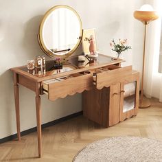 a dressing table with a mirror and drawers