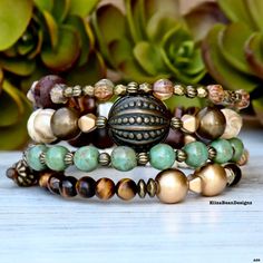 Express your unique style with this one of kind stack!   Beautiful soft colors and an eye catching Vintage Focal Bead from the 70s, make this the piece you will want to wear all of the time! **ONE OF A KIND For added health benefits, add your favorite essential oil to the Lava Stone. Made of memory wire that easily wraps around your wrist creating an incredible layered look in one bracelet. TO MAINTAIN THE INTEGRITY OF YOUR  HIGH QUALITY GEMSTONE BRACELET  PLEASE FOLLOW THESE CARE INSTRUCTIONS: Bohemian Round Wrap Bracelet As Gift, Bohemian Wrap Bracelet As Gift, Bohemian Style Round Wrap Bracelet As Gift, Bohemian Stackable Bracelets With Round Beads, Bohemian Stackable Round Bead Bracelets, Stackable Wrap Bracelet For Layering, Bohemian Stacked Round Bead Bracelets, Bohemian Style Adjustable Bracelet For Layering, Bohemian Stackable Jewelry