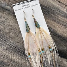 white peacock feather earrings > modern bride earrings > bohemian feather earrings > free spirit earrings > spiritual guidance earrings > peacock feather earrings These gorgeous white peacock feather earrings are perfect for a modern bohemian bride at their wedding, a free spirit, or anyone who appreciates feather jewelry. These beauties are made of peacock feathers, Swarovski crystals, hematite, and pierced french earring hooks, and measure approximately 3.5 to 4 inches in length Boho Feather Earrings, Bohemian Adjustable Teardrop Earrings, Bohemian Chandelier Earrings For Pierced Ears, Elegant Feather Jewelry For Festivals, Adjustable Dangle Feather Jewelry, Bohemian Pierced Chandelier Earrings For Wedding, Bohemian Feather Jewelry Gift, Bohemian Adjustable Chandelier Earrings, Adjustable Bohemian Chandelier Earrings