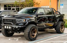 a black truck parked in front of a building