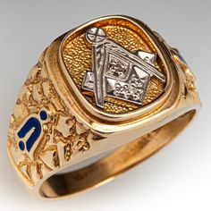 a gold and silver signet ring with two diamonds