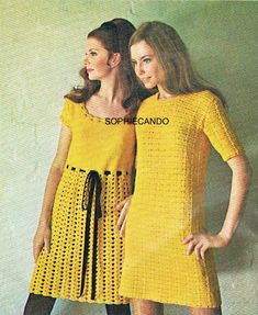 two women in yellow dresses standing next to each other with their hands on their hips