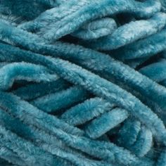 blue yarn is shown in close up view