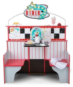 the diner booth is set up to look like it's ready for someone to order