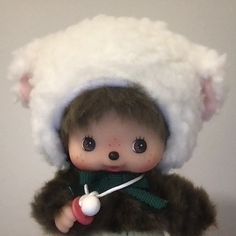 a stuffed animal with a white hat on it's head