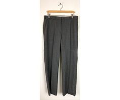 "-Description- >men's dark gray dress pants with white & red pinstripes >clip and zipper front >belt loops >open pockets in the front >one open and one button close pocket in the back >size 34 waist >great for a dressy event! >condition: very good >color(s): gray, red, white >fabric(s): woo. >brand: none >care: dry clean -Measurements- >size: 34 waist ✩ all measurements are taken with the item laying flat & some sizes are estimates so please check m Fitted Vertical Stripes Pants For Office, Fitted Pinstripe Dress Pants For Office, Fitted Striped Dress Pants With Welt Pockets, Fitted Vertical Striped Dress Pants For Business Casual, Business Striped Pants With Belt Loops, Fitted Vertical Stripe Office Pants, Fitted Striped Pants With Belt Loops, Gray Semi-formal Dress Pants, Semi-formal Gray Pants With Pockets