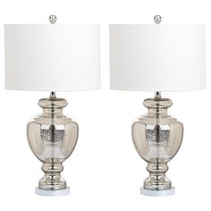 a pair of silver glass table lamps with white shades