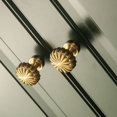 two golden knobs on the side of a door