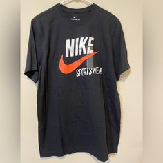 Nike T Shirt Brand New Size Medium Nike Orange Crew Neck T-shirt, Orange Crew Neck T-shirt With Logo Print, Nike Casual Orange Tops, Casual Nike Orange Tops, Casual Orange Nike Tops, Orange Graphic Tee With Logo Print, Casual Nike Black T-shirt, Casual Black Nike T-shirt, Sporty Orange Crew Neck Shirt