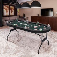 a black table with poker cards on it in a living room next to a couch