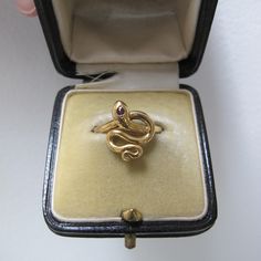 This is a really fun vintage piece.  A gold fill snake ring.  Very unique. Very good vintage condition. Head of ring measures 15.3mm by 12.9mm. 2.45g in weight Unknown marks on the inside of the shank; gold fill. Fits a size 6.0-6.25 best; not sizeable. This listing is for the ring only; antique ring box is not included. Please read all policies prior to purchase. Antique Ring Box, South Pasadena, Antique Ring, Snake Ring, Antique Rings, Ring Box, Rings Statement, Vintage Gold, Statement Rings