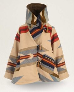 An exquisite statement piece, designed by Lindsey Thornburg and crafted from one of our wool jacquard blankets, woven in our Pendleton, Oregon mill. Each cloak is hand-cut, then sewn and finished in Lindsey’s Manhattan studio using premium trims. The bell-shaped silhouette features horn toggle closures, oversized raglan sleeves, a large cocoon hood, two welted patch pockets and a swingy fit for easy layering. Each cloak weighs 6 lbs. and is appropriate for mountain winters. This design features Lindsey Thornburg, Pendleton Blankets, Pendleton Blanket, Pendleton Woolen Mills, Blanket Coat, Sweat Dress, Hooded Cloak, Cotton Wool, Recycled Fabric