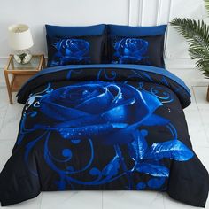 a bed with blue roses on it in a room