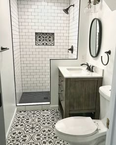 a white toilet sitting next to a walk in shower