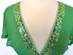 "Original Early 90s Vintage lovely Antik Batik Spring Green Pure Sheer Silk Crepe de Chine Sequinned Mardi Gras Festival Top, St Pat's wear, St Patrick's top blouse, Mother's Day gift, Easter outfit. Tag says size S but please check out measurements below as vintage sizes differ. Measurements: Shoulders 15\" Chest 34\" Waist 32\" Length 28 1/2\" Excellent condition, no issues. No real signs of wear or faults that I can see, all delicate and pretty sequins intact. I ship the same or the next day Holiday Party V-neck Blouse, Green Sequined Party Blouse, Festive Green Sequin Blouse, Fitted Holiday Blouse For Festive Occasions, Festive Green Sequined Blouse, Green Sequined Blouse For Evening, Festive Green Sequined Tops, Festive Green Sequin Tops, Festive Green V-neck Top