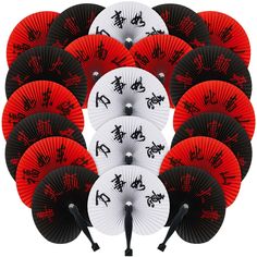 a bunch of red and black paper fans with chinese characters on them are arranged in a row