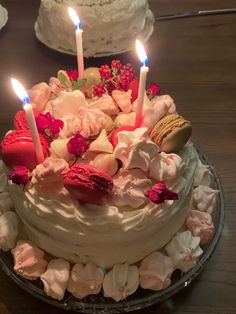 a cake with candles on it sitting on a table