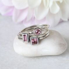 "Know someone with an June birthday ~ this is the perfect gift! Stackable birthstone rings are the IT accessory. Wear by itself or pair with with an initial ring! **This listing is for one sterling silver stackable birthstone ring with a Swarovski crystal (please see color chart for color selection). Round, square, rectangle, marquise, heart or cross stone settings are available.** Also available in January, February, March, April, May, June, July, August, September, October, November, or Decemb Stackable Rings With May Birthstone For Birthday, Gift Stackable Rings With Bezel Setting For May Birthstone, May Birthstone Stackable Rings With Bezel Setting, Pink Stackable Birthstone Promise Ring, Pink Adjustable Birthstone Ring For Anniversary, Stackable Bezel-set Rings For May Birthstone Gift, Minimalist Pink Crystal Ring As Gift, Stackable May Birthstone Ring For Birthday, May Birthstone Stackable Ring For Birthday