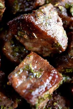 close up view of meat with herbs and seasoning on it's surface,