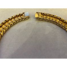 This is part of Chairish’s Costume Jewelry assortment.  A magnificent and weighty gold-tone and white enameled Ciner choker/collar, ca. late 1950s/early 1960s.  This choker belonged to a notable costume jewelry industry professional, who worked for Trifari.  Ciner jewelry was founded in New York City in 1892 as a fine jeweler and this family-owned operation is still in business today!  Since 1931, the company has produced fine costume jewelry. Antique Gold Choker Jewelry, Luxury Yellow Gold Choker For Formal Events, Vintage Gold Choker For Formal Occasions, Gold Choker With 17 Jewels, Luxury Gold Choker For Formal Occasions, Vintage Gold Bracelet With Polished Finish, Formal Yellow Gold Plated Choker, Luxury Gold Choker With 17 Jewels, Vintage Gold Chain Choker Jewelry