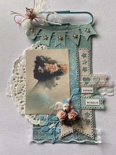 an altered photo with flowers and lace on it