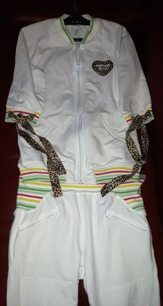 "Roberto Cavalli white tracksuit 2 pieces set with yellow, red and greens stripes and leopard print ribbons. Hologramed sportswear - jacket and pants - two pieces. Running clothing. Women`s tracksuit italian design EUropean size: S. condition: great vintage. On the sleeve is one small brown needles size point spot. measurements: jacket length 58,5 cm / 23\" in jacket armpit to armpit 45,5 cm / 17.9\" in semi trousers length 68 cm / 26,8\" in waist 68 cm (adjustable) / 26.8\" in" White Stretch Tracksuit For Sportswear, White Sporty Tracksuit With Pockets, White Tracksuit With Pockets For Sports, Sporty White Tracksuit With Pockets, White Fitted Tracksuit Sportswear, White Fitted Casual Tracksuit, White Spring Sports Tracksuit, White Sporty Tracksuit For Spring, White Tracksuit For Sports In Spring