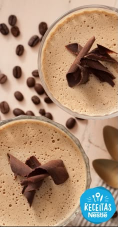 two glasses filled with chocolate and coffee beans