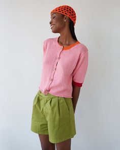 If you need a little joy in your outfit and in your day, this casual piece provides the dose of color and originality you need. Tricolor short sleeve cardigan. Pink knit body, contrasting orange back and red cuff details The details- Fine and fluid cotton fabric Designed in Barcelona Made in Italy Salmon Color Outfit, Coral Top Outfit, Red Cotton Summer Cardigan, Orange And Pink Sweater, Spring Cotton Color Block Cardigan, Casual Orange Cotton Cardigan, Spring Color Block Cotton Cardigan, Hand-knitted Pink Cotton Sweater, Playful Pink Knitted Sweater