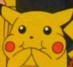 a close up of a cartoon pikachu with big eyes and an angry look on his face