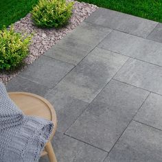 Create an eye-catching patio, walkway, path or pool deck. Drycast concrete is durable and requires little maintenance. Permanent weather resistant color. Subtle blend of gray and charcoal color tones. Color, dimension, weight and texture may vary slightly due to natural materials used during manufacturing. Oldcastle 24-in L x 12-in W x 2-in H Rectangle Rio Blend Concrete Patio Stone in Gray | 10994254 Patio With Concrete Squares, Crushed Concrete Patio, Rectangle Paver Patio, Back Patio Flooring Ideas, Cement Pavers Patio, Black Concrete Patio, Dark Grey Deck, Slate Patio Ideas, Backyard Patio Flooring